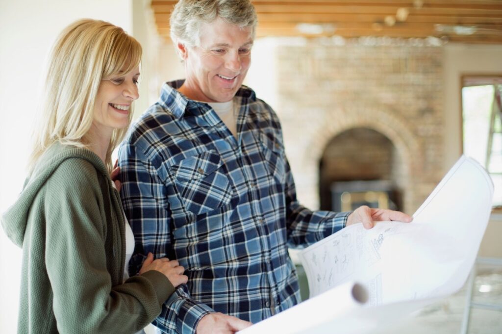 Couple with house plans