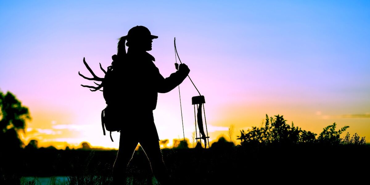 Untitled design – 1 Woman bow hunting for white-tailed deer