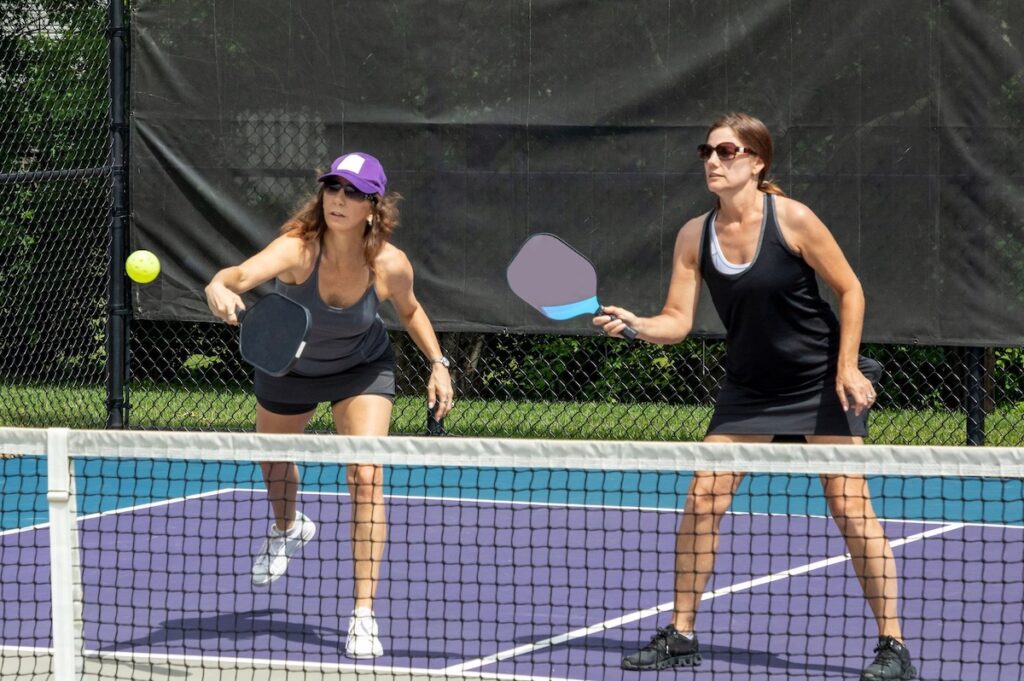 Women playing pickleball