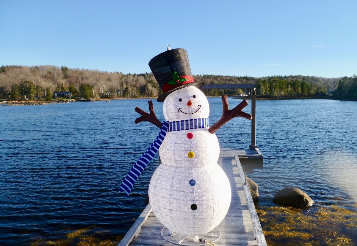 Untitled design – 5 Snowman on a lake dock