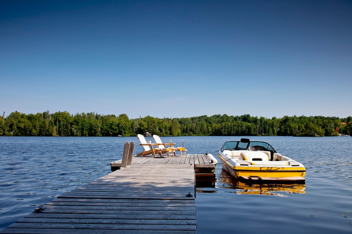 Yellow ski boat and a dock