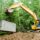 Septic system being put in place by backhoe