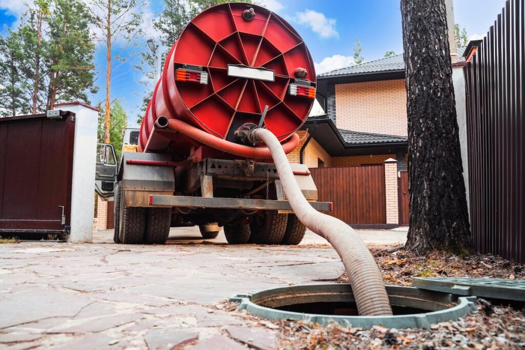 Septic truck cleaning a system