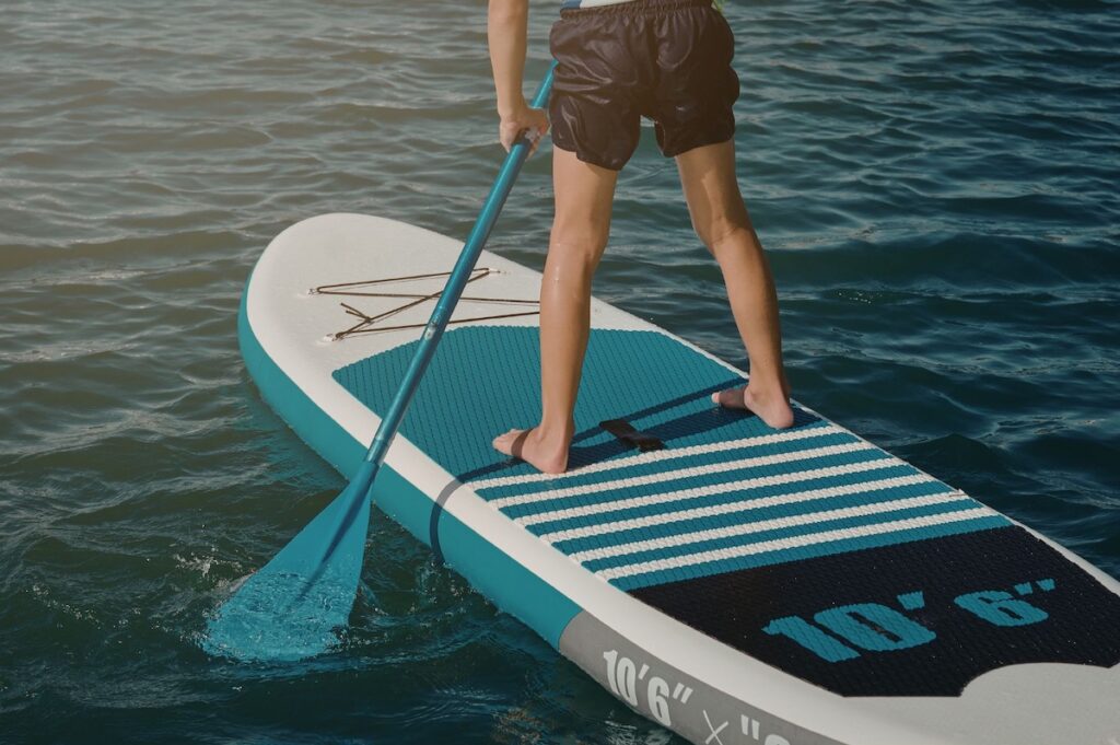 Young man on paddle board